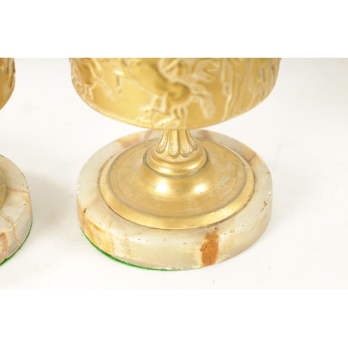 408 - A PAIR OF LATE 19TH CENTURY FRENCH GILT BRONZE CLASSICAL EWERS ON ALABASTER BASES with slender flare... 