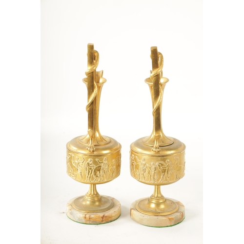 408 - A PAIR OF LATE 19TH CENTURY FRENCH GILT BRONZE CLASSICAL EWERS ON ALABASTER BASES with slender flare... 