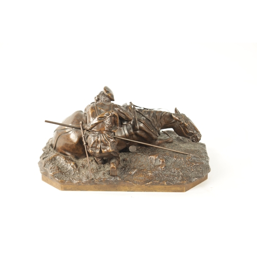 411 - A 19TH CENTURY RUSSIAN BRONZE SCULPTURE depicting a solider firing a gun laid on his horse - inscrib... 