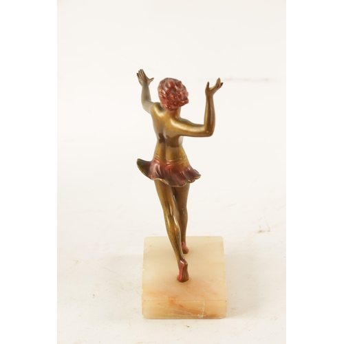 414 - A LORENZL STYLE ART DECO COLD PAINTED SPELTER FIGURE Modelled as a semi-nude dancer on rectangular o... 