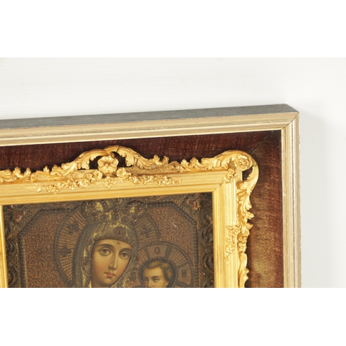 415 - A 19TH CENTURY RUSSIAN ICON depicting Virgin Mary and Christ in later glazed frame (18.5cm high, 14.... 