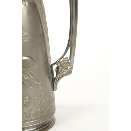 421 - AN ART NOUVEAU ORIVIT PEWTER JUG decorated with a deer in woodland and a fox hunting ducks on a lake... 