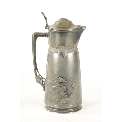 421 - AN ART NOUVEAU ORIVIT PEWTER JUG decorated with a deer in woodland and a fox hunting ducks on a lake... 