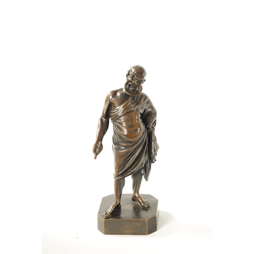 424 - A 19TH CENTURY FIGURAL BRONZE SCULPTURE modelled as a philosopher with grotesque mask, inscribed 