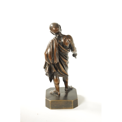 424 - A 19TH CENTURY FIGURAL BRONZE SCULPTURE modelled as a philosopher with grotesque mask, inscribed 