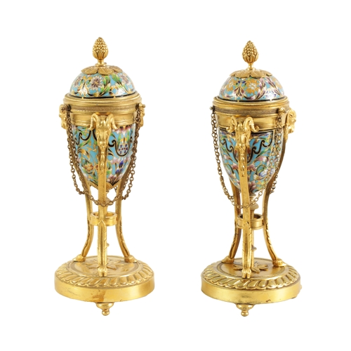 432 - A PAIR OF LATE 19TH CENTURY FRENCH ORMOLU AND CHAMPLEVE ENAMEL CASSOLETTES the domed lids reversing ... 