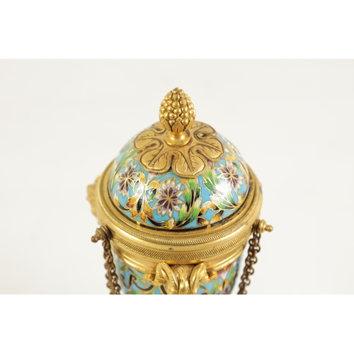 432 - A PAIR OF LATE 19TH CENTURY FRENCH ORMOLU AND CHAMPLEVE ENAMEL CASSOLETTES the domed lids reversing ... 