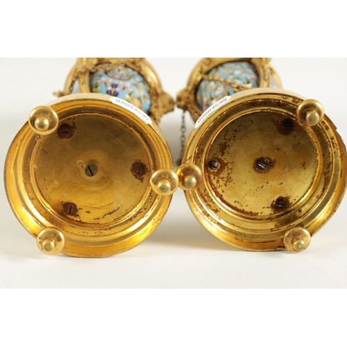 432 - A PAIR OF LATE 19TH CENTURY FRENCH ORMOLU AND CHAMPLEVE ENAMEL CASSOLETTES the domed lids reversing ... 