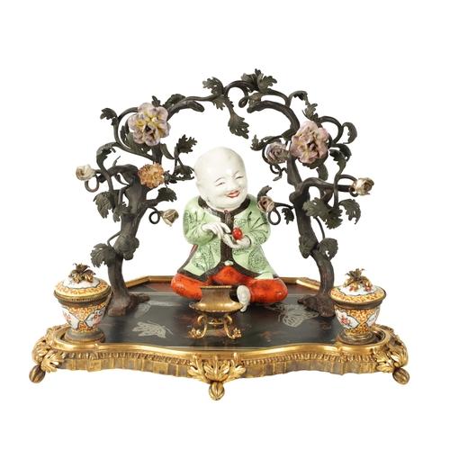 434 - A 19TH CENTURY CONTINENTAL ORMOLU, LACQUERWORK AND PORCELAIN PEN AND INK STAND with seated porcelain... 