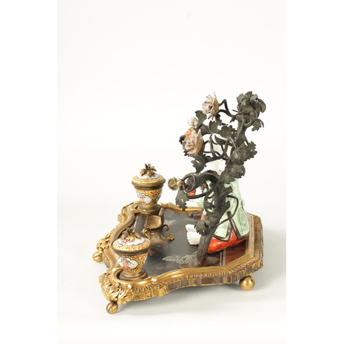 434 - A 19TH CENTURY CONTINENTAL ORMOLU, LACQUERWORK AND PORCELAIN PEN AND INK STAND with seated porcelain... 