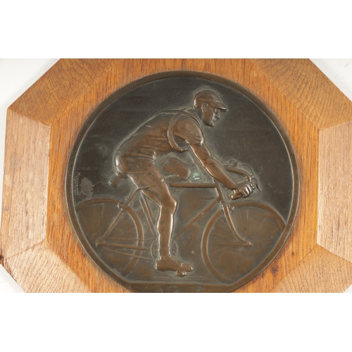 438 - OF CYCLING INTEREST. AN EARLY 20TH CENTURY BRONZE DEPICTING A CYCLER ON A RACING BIKE mounted on a o... 