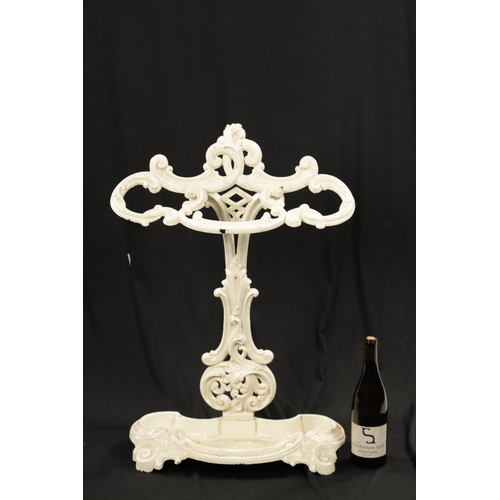 439 - A 19TH CENTURY CAST IRON STICK STAND IN THE COALBROOKDALE STYLE having a scrolled leaf cast frame - ... 