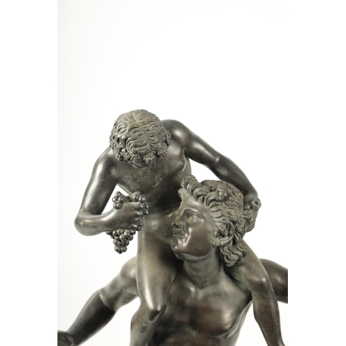 440 - A LARGE 19TH CENTURY FRENCH FIGURAL BRONZE SCULPTURE modelled as a young Pan sat on Bacchus shoulder... 