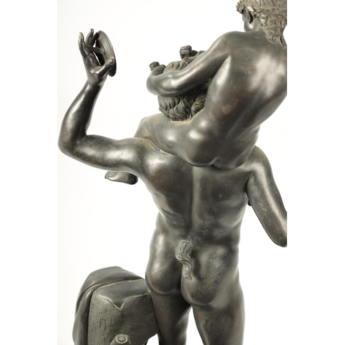 440 - A LARGE 19TH CENTURY FRENCH FIGURAL BRONZE SCULPTURE modelled as a young Pan sat on Bacchus shoulder... 