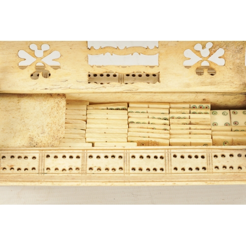 443 - AN OVERSIZED 19TH CENTURY BONE PRISONER OF WAR CRIBBAGE AND DOMINOES SET with domed pierced hinged t... 