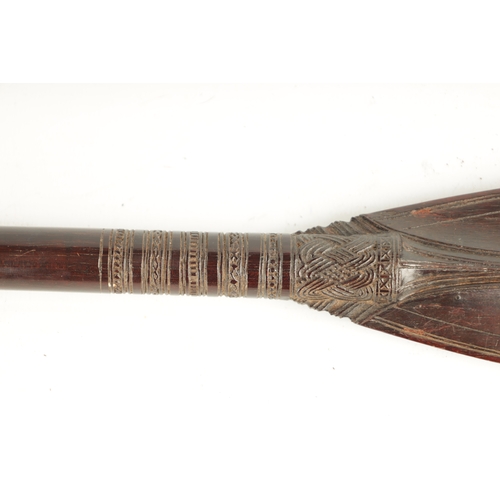 446 - A NATIVE AMERICAN NORTH WEST COAST HARDWOOD HAIDA PADDLE with interwoven carved and scratch-lined bl... 