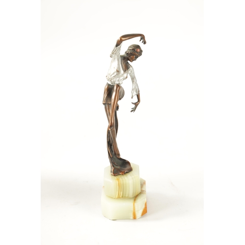 447 - ATT. JOSEF LORENZL AN ART DECO COLD PAINTED BRONZE FIGURE depicting an exotic female dancer wearing ... 