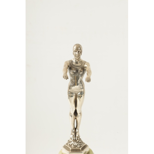 452 - A FINE ART DECO SILVER AND ONYX SET TROPHY FIGURE OF A DIVER the standing female figure with arms ou... 