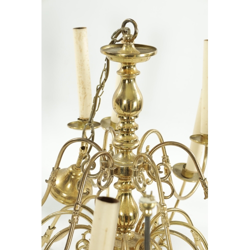 454 - A LARGE 20TH CENTURY BRASS HANGING LIGHT with shaped arms holding eighteen candle lights, with bulbo... 