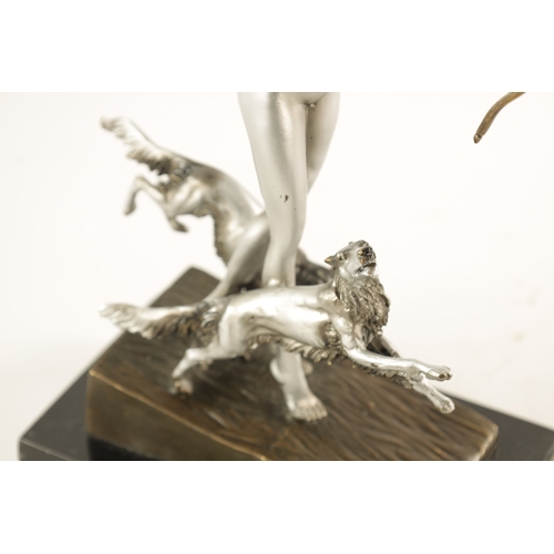 455 - AN ART DECO STYLE FIGURAL SILVERED BRONZE SCULPTURE modelled as Diana the huntress standing on a slo... 