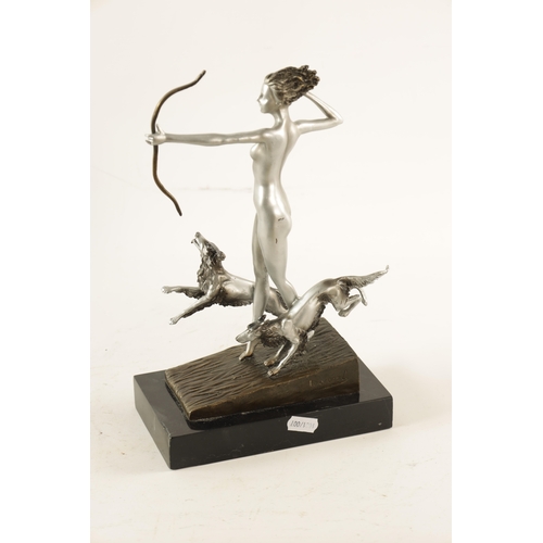 455 - AN ART DECO STYLE FIGURAL SILVERED BRONZE SCULPTURE modelled as Diana the huntress standing on a slo... 