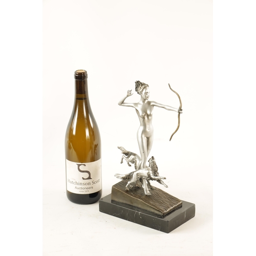 455 - AN ART DECO STYLE FIGURAL SILVERED BRONZE SCULPTURE modelled as Diana the huntress standing on a slo... 