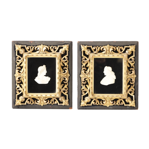 459 - A FINE PAIR OF 19TH CENTURY ITALIAN CARVED IVORY BUSTS in gilt florentine leaf carved frames, depict... 