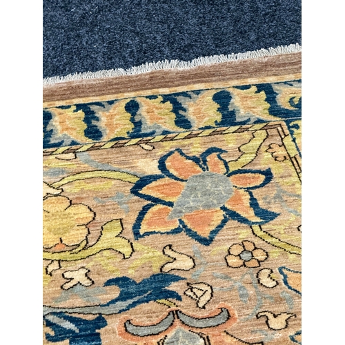 460 - A FINE CARPET OF ARTS AND CRAFTS DESIGN beige ground with overall design of bold multicoloured flowe... 