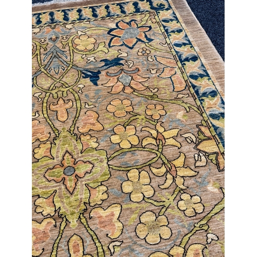 460 - A FINE CARPET OF ARTS AND CRAFTS DESIGN beige ground with overall design of bold multicoloured flowe... 