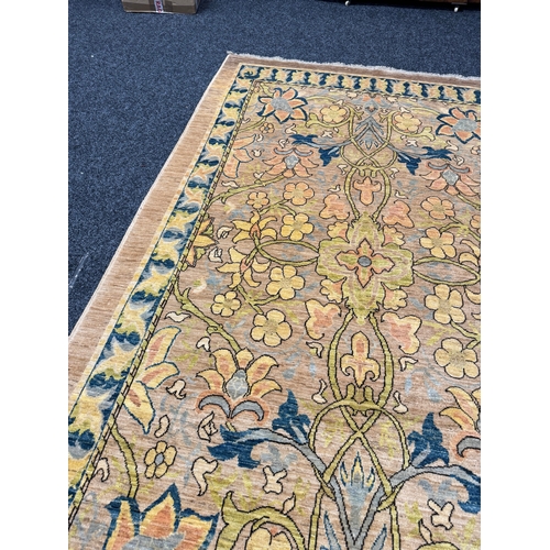 460 - A FINE CARPET OF ARTS AND CRAFTS DESIGN beige ground with overall design of bold multicoloured flowe... 