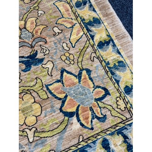 460 - A FINE CARPET OF ARTS AND CRAFTS DESIGN beige ground with overall design of bold multicoloured flowe... 