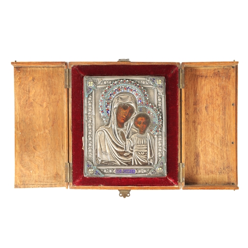 462 - A SILVER AND ENAMEL RUSSIAN ICON depicting Virgin Mary and Child - fitted in a hinged oak case with ... 