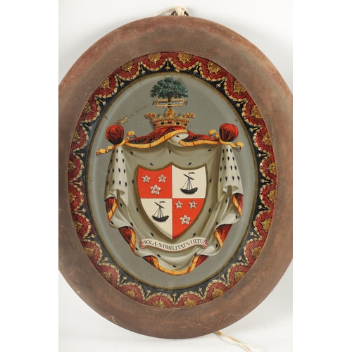 464 - A PAIR OF 19TH CENTURY FRAMED REVERSE PAINTED GLASS ARMORIAL PANELS the crested shield shaped inscri... 