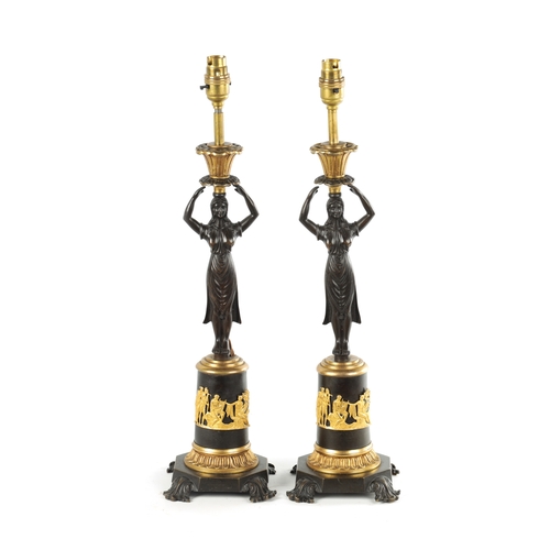 465 - A PAIR OF LATE 19TH CENTURY REGENCY STYLE BRONZE AND ORMOLU MOUNTED FIGURAL LAMP BASES with standing... 