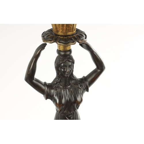 465 - A PAIR OF LATE 19TH CENTURY REGENCY STYLE BRONZE AND ORMOLU MOUNTED FIGURAL LAMP BASES with standing... 