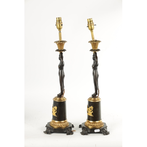 465 - A PAIR OF LATE 19TH CENTURY REGENCY STYLE BRONZE AND ORMOLU MOUNTED FIGURAL LAMP BASES with standing... 