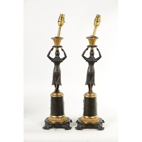 465 - A PAIR OF LATE 19TH CENTURY REGENCY STYLE BRONZE AND ORMOLU MOUNTED FIGURAL LAMP BASES with standing... 