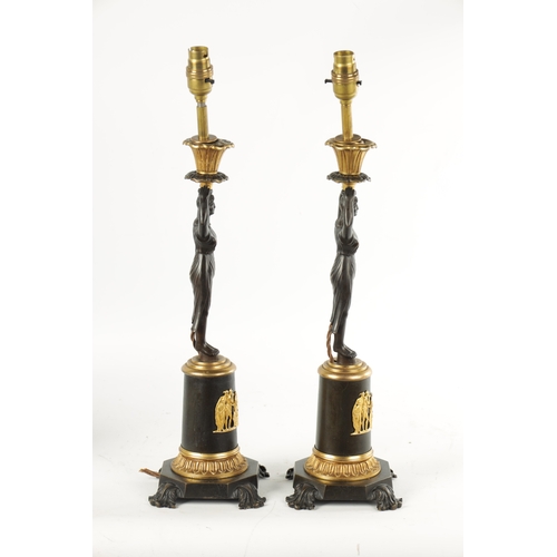 465 - A PAIR OF LATE 19TH CENTURY REGENCY STYLE BRONZE AND ORMOLU MOUNTED FIGURAL LAMP BASES with standing... 