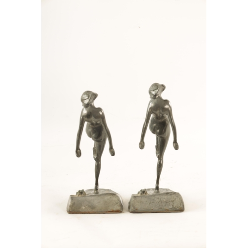 467 - A PAIR OF ART NOVEAU PEWTER FIGURAL BOOKENDS modelled as nude dancing girls standing on naturalist b... 