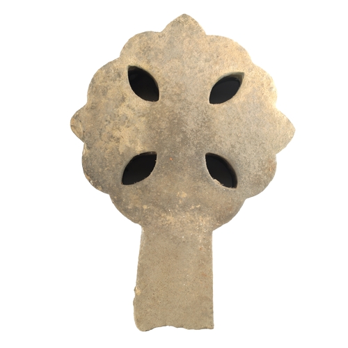 468 - AN EARLY CARVED STONE CELTIC CROSS with cut leaf shaped apertures and shaped surround (42.5cm high 3... 