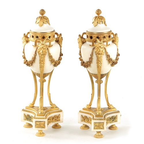 476 - A LARGE PAIR OF 19TH CENTURY FRENCH WHITE MARBLE AND ORMOLU CASSOLETTES each with reversible candle ... 