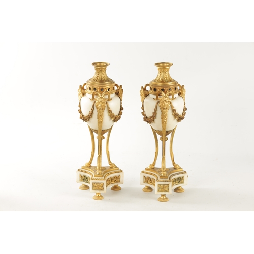 476 - A LARGE PAIR OF 19TH CENTURY FRENCH WHITE MARBLE AND ORMOLU CASSOLETTES each with reversible candle ... 