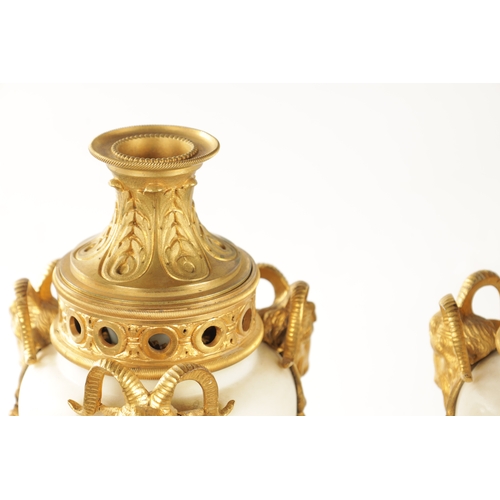 476 - A LARGE PAIR OF 19TH CENTURY FRENCH WHITE MARBLE AND ORMOLU CASSOLETTES each with reversible candle ... 