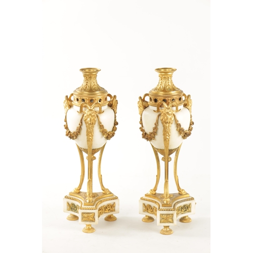 476 - A LARGE PAIR OF 19TH CENTURY FRENCH WHITE MARBLE AND ORMOLU CASSOLETTES each with reversible candle ... 