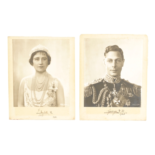 547 - A PAIR OF SIGNED PHOTOGRAPHS OF KING GEORGE VI AND HIS WIFE ELIZABETH (1895-1952) A large vintage si... 