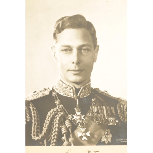 547 - A PAIR OF SIGNED PHOTOGRAPHS OF KING GEORGE VI AND HIS WIFE ELIZABETH (1895-1952) A large vintage si... 