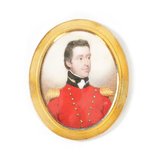 558 - A 19TH CENTURY OVAL MILITARY PORTRAIT MINIATURE ON IVORY depicting a bust of an army officer in a re... 