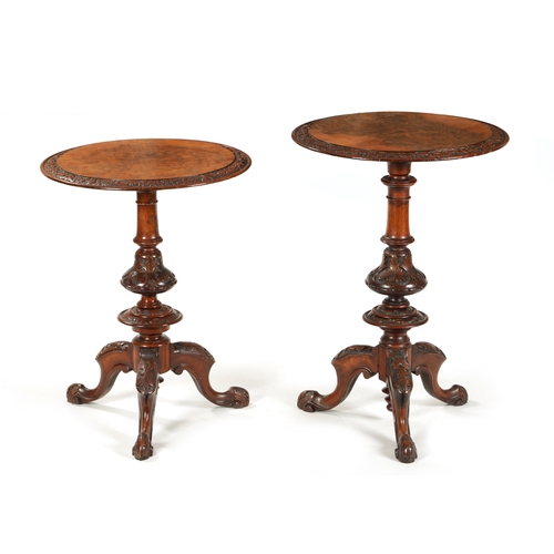 1017 - A MATCHED PAIR OF VICTORIAN BURR WALNUT OCCASIONAL TABLES with circular tops having elaborately carv... 