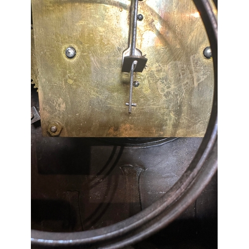 652 - AN ARTS AND CRAFT COPPER AND BRASS MANTEL CLOCK the planished case with domed top and relief Arabic ... 