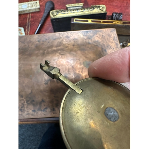 652 - AN ARTS AND CRAFT COPPER AND BRASS MANTEL CLOCK the planished case with domed top and relief Arabic ... 